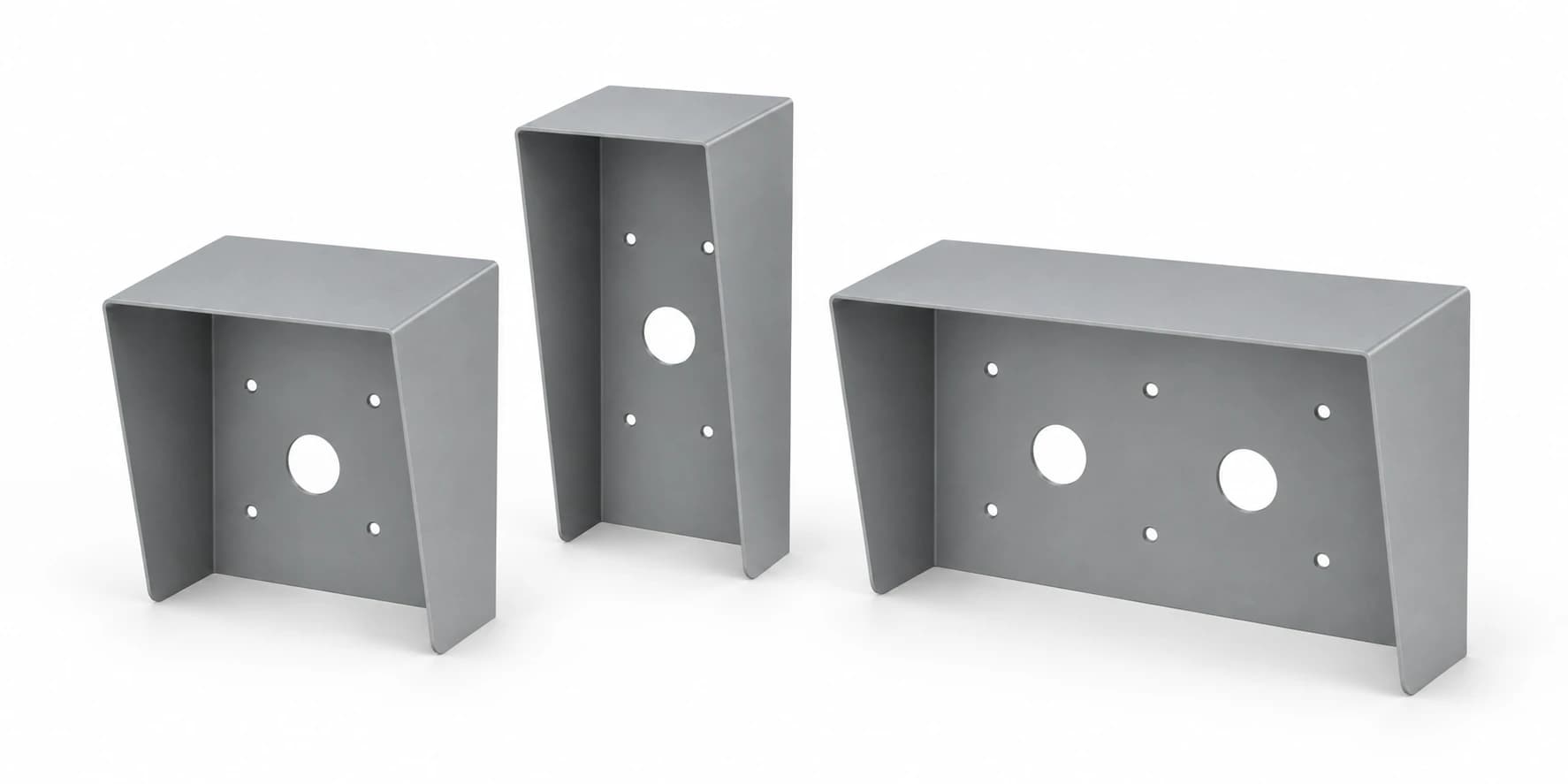 Three formed metal shrouds in different sizes, with pre-cut mounting holes.
